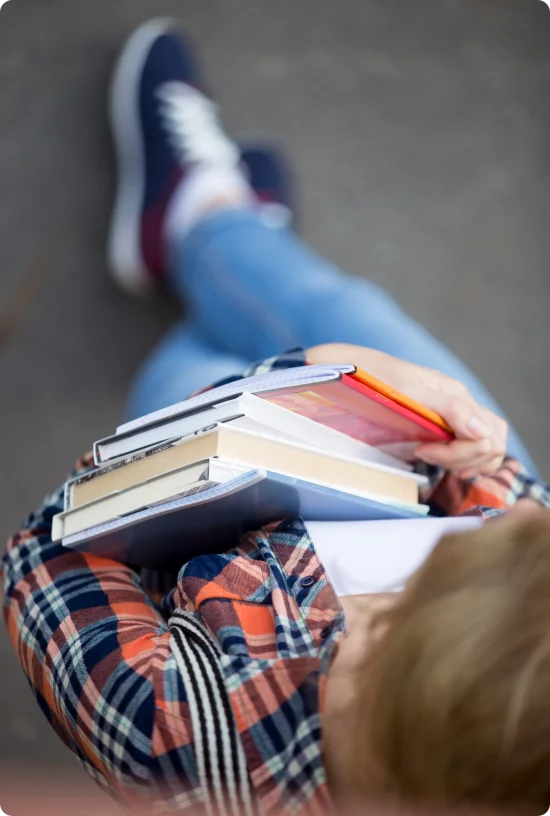 student-girl-with-heap-textbooks-notebooks